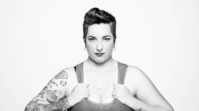 Black and white portrait of a muscular woman with tattoos, with the text "queer femme" below