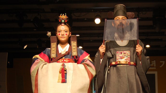 Oriental dressed boy and girl on a catwalk