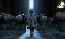 Scene of a girl standing in front of animals in "The Golden Compass"