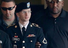 Chelsea Manning standing in his uniform