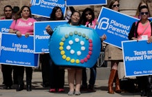 Group of people protesting because Congress is messing with birth control decisions