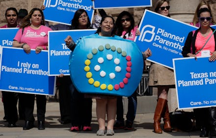Group of people protesting because Congress is messing with birth control decisions
