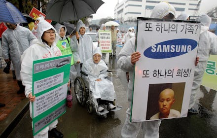 Factory workers in South Korea protesting against smartphone companies