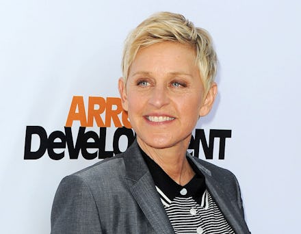Ellen DeGeneres posing with a grey blazer