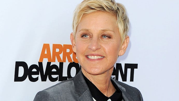 Ellen DeGeneres posing with a grey blazer