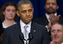 Barack Obama at a podium with microphones looking disappointed as young people aren't signing up for...