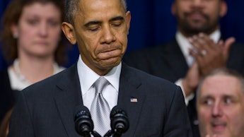 Barack Obama at a podium with microphones looking disappointed as young people aren't signing up for...