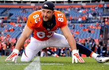 Wes Welker stretching on the field 