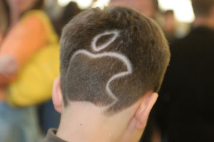 A man with a buzz cut and the Apple logo buzzed out on it