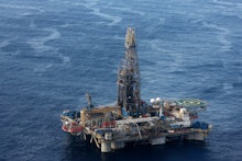 An oil drilling platform in the middle of the ocean