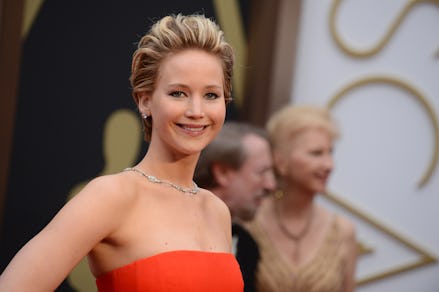 Jennifer Lawrence in a red dress and diamond necklace at the Oscars award show