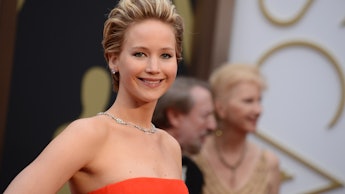 Jennifer Lawrence in a red dress and diamond necklace at the Oscars award show