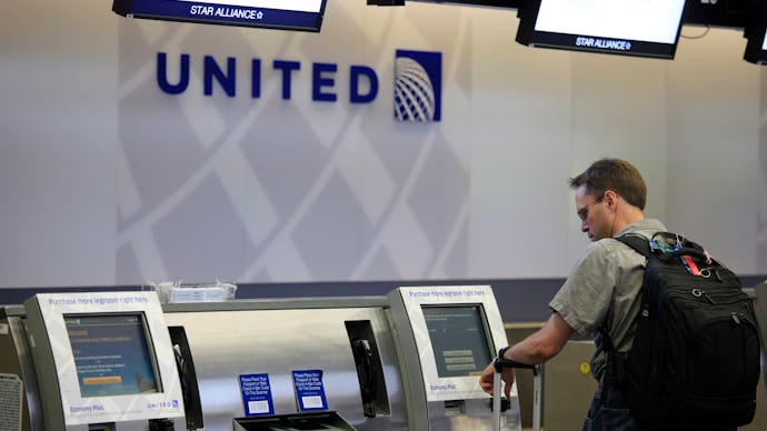 A man checking in for the flight with United Airlines