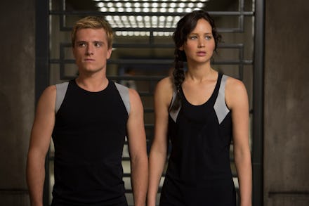 Peeta and Katniss in their work out gear in a scene from the hunger games movie