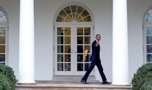 Barack Obama walking in front of the White House