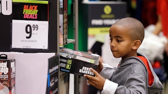 A young boy shopping for Black Friday