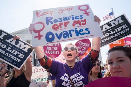 A group of women attending a protest against doctors who tell patients some abortions are reversible