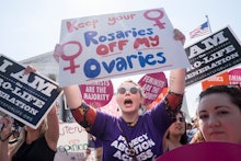 A group of women attending a protest against doctors who tell patients some abortions are reversible