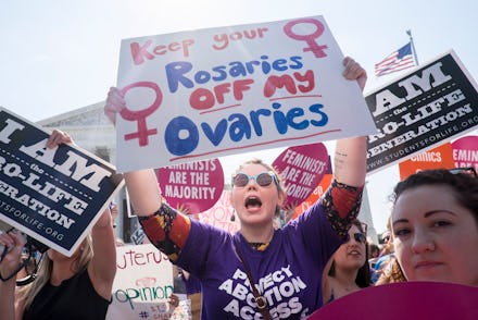 A group of women attending a protest against doctors who tell patients some abortions are reversible