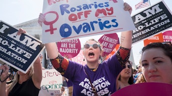 A group of women attending a protest against doctors who tell patients some abortions are reversible