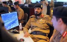 Saudi Arabian military sitting at computers 