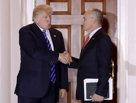 Donald Trump shaking hands with Andrew Puzder