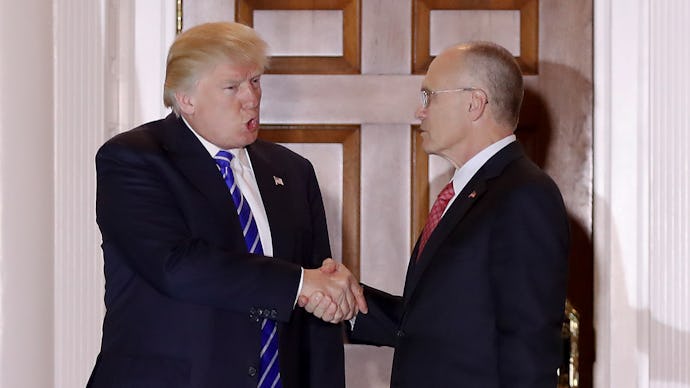 Donald Trump shaking hands with Andrew Puzder