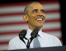 Barack Obama giving a speech with the flag of the U.S. in his background.