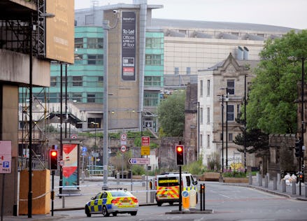 An ambulance and police car going down the street after the Manchester attack 