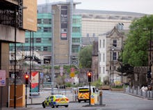 An ambulance and police car going down the street after the Manchester attack 