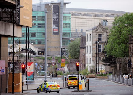 An ambulance and police car going down the street after the Manchester attack