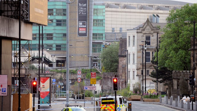 An ambulance and police car going down the street after the Manchester attack 