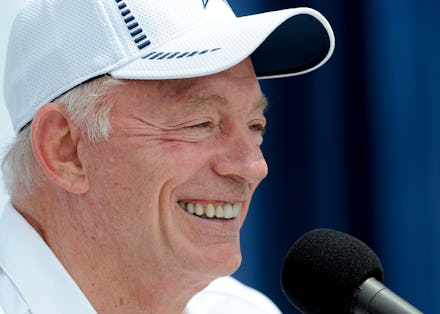 Dallas Cowboys owner Jerry Jones sitting in a white cap after a sexual assault charged is filed agai...