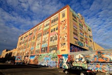 5Pointz in New York covered in graffiti all over the building before it gets demolished and turned i...