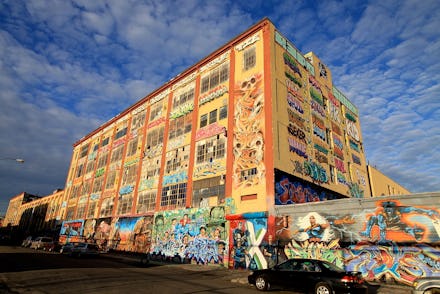 5Pointz in New York covered in graffiti all over the building before it gets demolished and turned i...