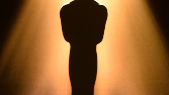 An Oscar award under a spotlight