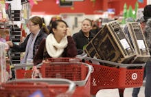 People shopping during Black Friday with their shopping carts full 