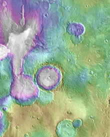 An aerial view of Mars's surface with a contrasting color filter