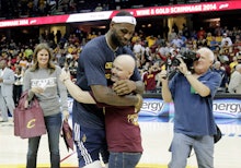 16-year-old fighting leukemia, Jackie Custer, hugging LeBron James during a basketball game