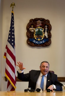 Republican Gov. Paul LePage of Maine looking angry at a press conference.