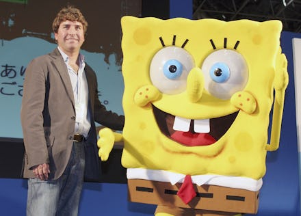 Stephen Hillenburg posing for a photo with a SpongeBob mascot