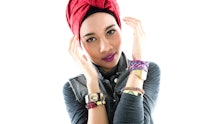 Yuna a malaysian singer posing in front of a white background