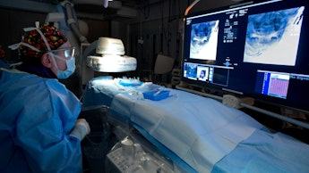 A doctor in a prepared hospital room for a surgery