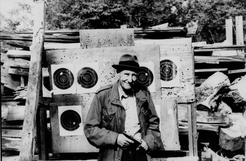 William S. Burroughs holding the gun at the firing range