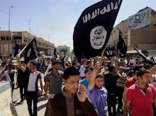 The Islamic State militant group walking in the Iraqi city of Mosul