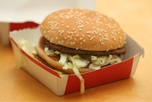 A McDonalds burger in a carton box