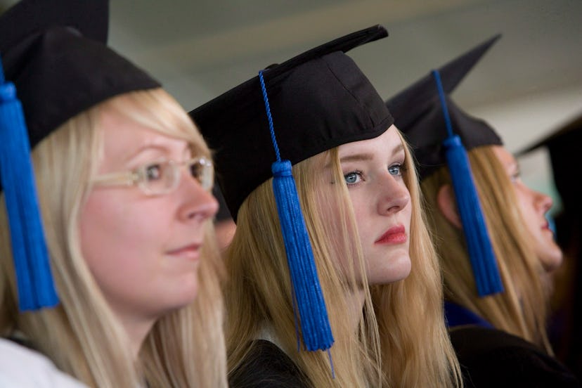 Blonde young women wearing graduate hats