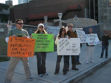 A group of lgbt allies standing on the streets with signs of support