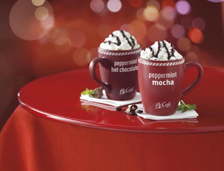 Two red mugs with McDonald's peppermint mocha and peppermint hot chocolate bagged coffee