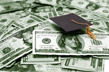 A pile of dollar bills and an academic cap on top of it representing the student debt survival guide